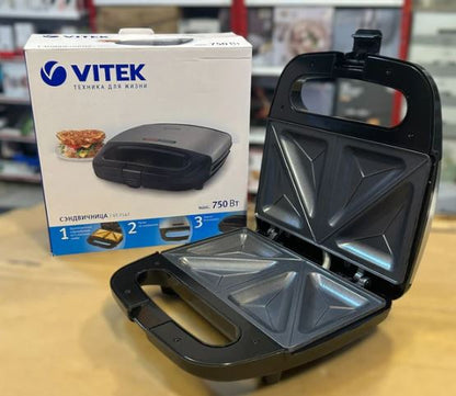 Vitek VT-7147 Sandwich Maker 750W – 4 Slice with non-stick triangular plates open beside its packaging box on table